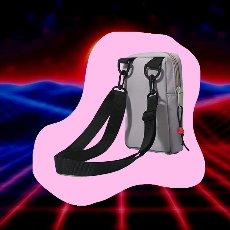 May include: A light gray crossbody bag with a black adjustable strap and black hardware. The bag has a zipper closure and a small red accent. The background is a retro-style design with pink, red, and blue colors.