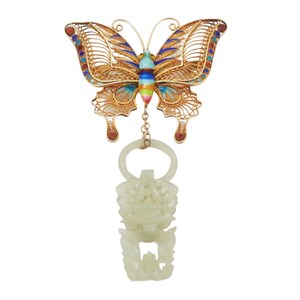 May include: A gold butterfly pendant with colorful enamel details and a jade pendant hanging from a chain. The jade pendant is carved with a floral design.