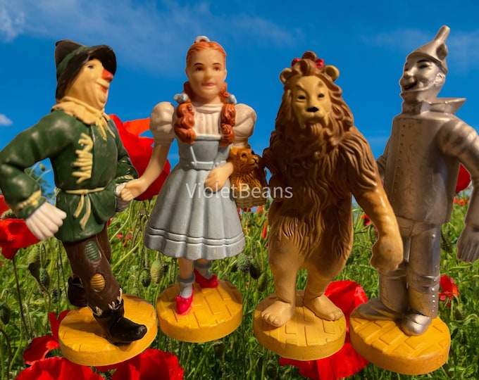Wizard of Oz Figurines Set of Four Dorothy Scarecrow Cowardly Lion Tin Man Loews Collectible Toy