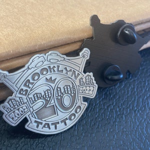 Brooklyn Tattoo 20th anniversary enamel pin.