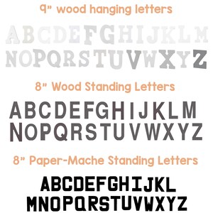 May include: A display of wooden and paper-mache letters in various sizes and colors. The image shows 9-inch wood hanging letters, 8-inch wood standing letters, and 8-inch paper-mache standing letters, all in the alphabet.
