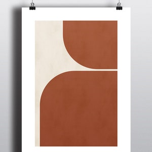 May include: Abstract art print with a geometric design featuring two overlapping semi-circles in shades of brown and beige.