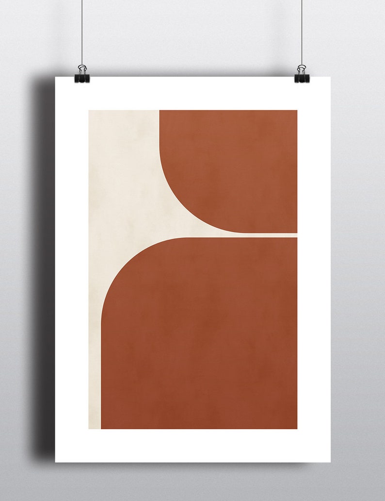 May include: Abstract art print with a geometric design featuring two overlapping semi-circles in shades of brown and beige.
