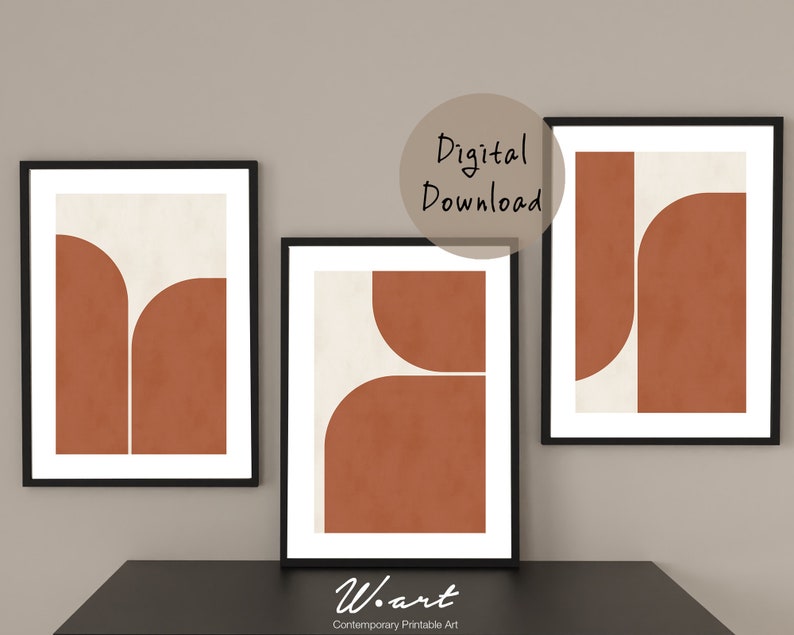 May include: Three printable art prints with a minimalist geometric design. The prints feature a white background with overlapping shapes in a burnt orange color. The text "Digital Download" is visible in the top center of the image.