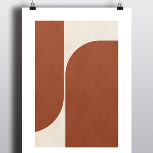 May include: Abstract geometric art print with a white background and two overlapping shapes in a burnt orange color.