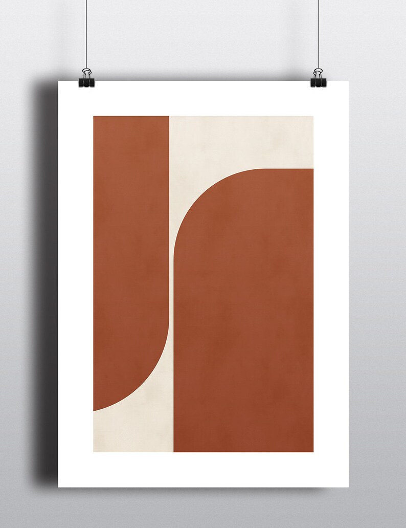May include: Abstract geometric art print with a white background and two overlapping shapes in a burnt orange color.