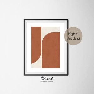 May include: Abstract geometric art print with a brown and cream color scheme. The print features two overlapping shapes, one a rectangle and the other a curved shape. The print is framed in a black frame.