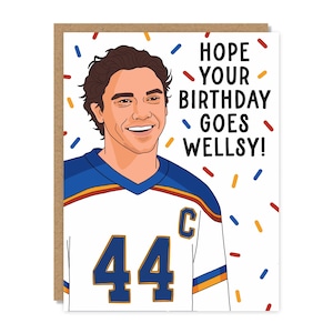 May include: A greeting card featuring a cartoon illustration of a person with dark hair wearing a white, blue, and orange hockey jersey with the number 44 and a C on the chest. The text reads HOPE YOUR BIRTHDAY GOES WELLSY! with colorful sprinkles.