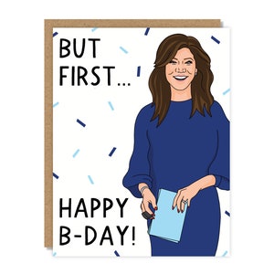 May include: A birthday card with a white background and blue and black confetti. The card features a cartoon illustration of a woman with brown hair wearing a blue dress and holding a blue envelope. The text on the card reads "BUT FIRST... HAPPY B-DAY!"