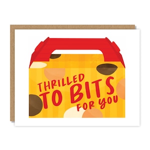 May include: Greeting card with a brown border and a white interior. The card features a yellow box design with the text "Thrilled to Bits For You" in red and yellow. The box has brown and orange polka dots.