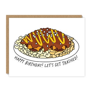 May include: A birthday card with a cartoon illustration of a plate of macaroni and cheese with chili and a yellow topping. The text on the card reads "Happy Birthday! Let's Get Trashed!"