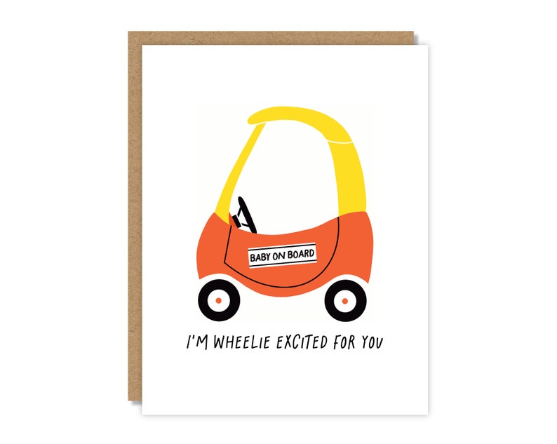 May include: A red and yellow toy car with a "Baby on Board" sign. The card reads "I'm wheelie excited for you".