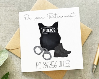 May include: A white card with a black and white illustration of a police officer's uniform, handcuffs, and boots. The text "On your Retirement" is at the top of the card. The text "PC 34256 JULES" is at the bottom of the card.