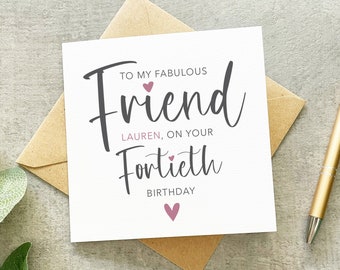 May include: A white card with a pink heart and the text "To my fabulous friend Lauren, on your Fortieth Birthday" in black script.