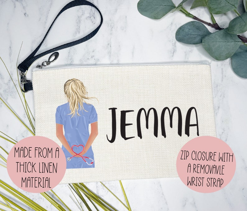 May include: A white canvas zippered pouch with a black wrist strap. The pouch features a cartoon illustration of a nurse with a stethoscope and the name "Jemma" printed in black. The pouch is made from a thick linen material.