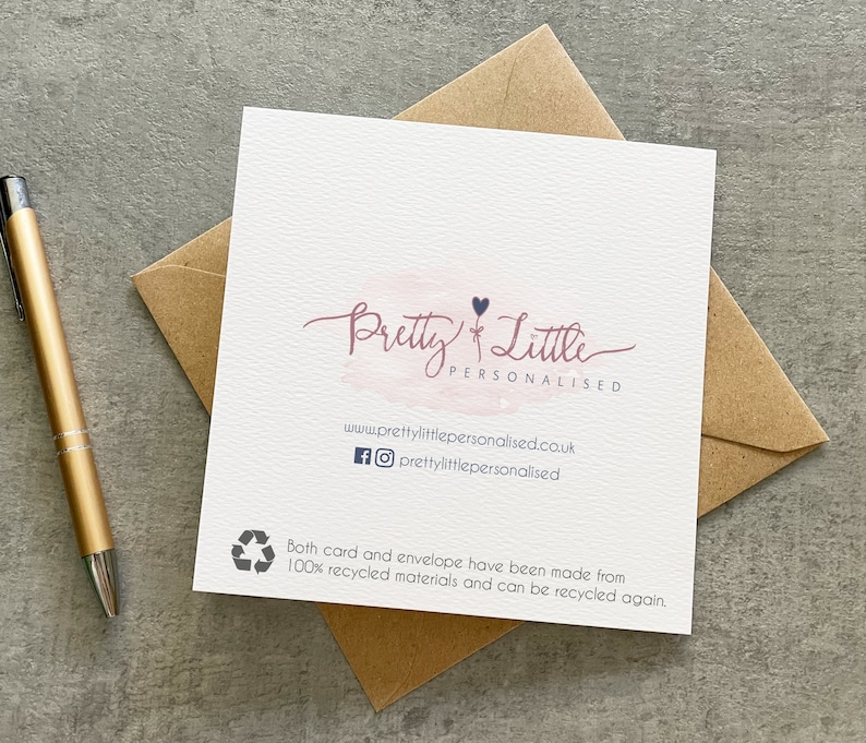 May include: A white card with a pink watercolor background and the text "Pretty Little Personalised" in black script. The card also includes a small black heart and the website address "www.prettylittlepersonalised.co.uk" in black text. The card is surrounded by a brown envelope.