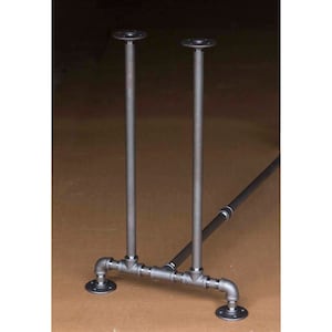 May include: Black metal table legs with a pipe design. The legs are connected by a horizontal pipe and have a round base.