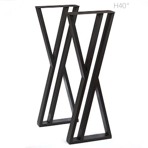 May include: Two black metal table legs with an X-shaped design. The legs are 40 inches (101.6 cm) tall.