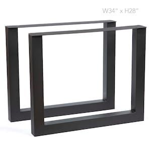 May include: Two black metal table legs, each with a rectangular frame design. The dimensions are W34" x H28". The legs are suitable for a variety of table projects.