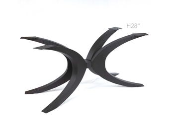 May include: Black metal table base with a curved, X-shaped design. The base is 28 inches tall.