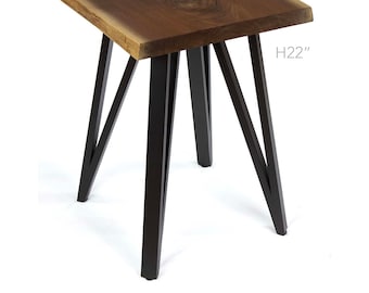 May include: A wooden side table with a natural wood top and black metal legs. The table is 22 inches tall. H22"