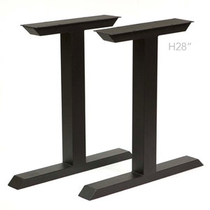 May include: Two black metal table legs with a T-shaped top and a height of 28 inches. The legs are angled at the bottom for stability.