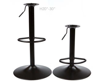 May include: Two black metal bar stool bases with adjustable height. The base on the left is taller and has a footrest. The base on the right is shorter and does not have a footrest. The text "H20"-30" is printed on the image.