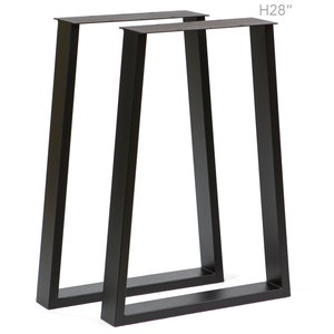 May include: Two black metal table legs with a slanted design. The legs are 28 inches tall.