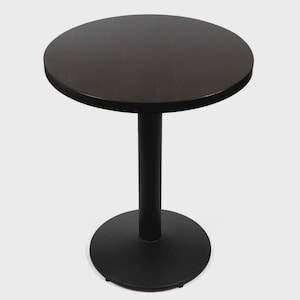 May include: A round, dark brown table with a black, cylindrical pedestal base and a circular base. The table is approximately 28 inches in diameter and stands about 30 inches tall. The design is simple and modern, suitable for various settings.