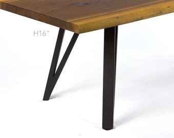 May include: A wooden table top with a live edge and black metal legs. The table is 16 inches tall.
