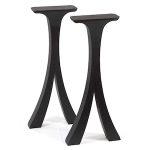 May include: Two black, curved table legs with a flat top and a flared base. The legs have a modern, minimalist design and are made of a solid, dark material. The legs are designed to support a tabletop.