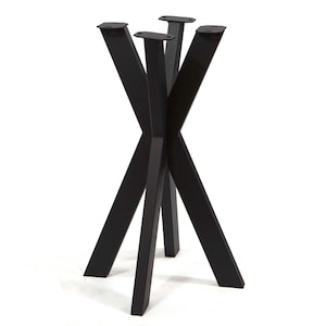 May include: A black metal table base featuring four angled legs that intersect in the center. Each leg has a flat rectangular mounting plate at the top with two pre-drilled holes for attachment, providing a stable support structure for a tabletop.
