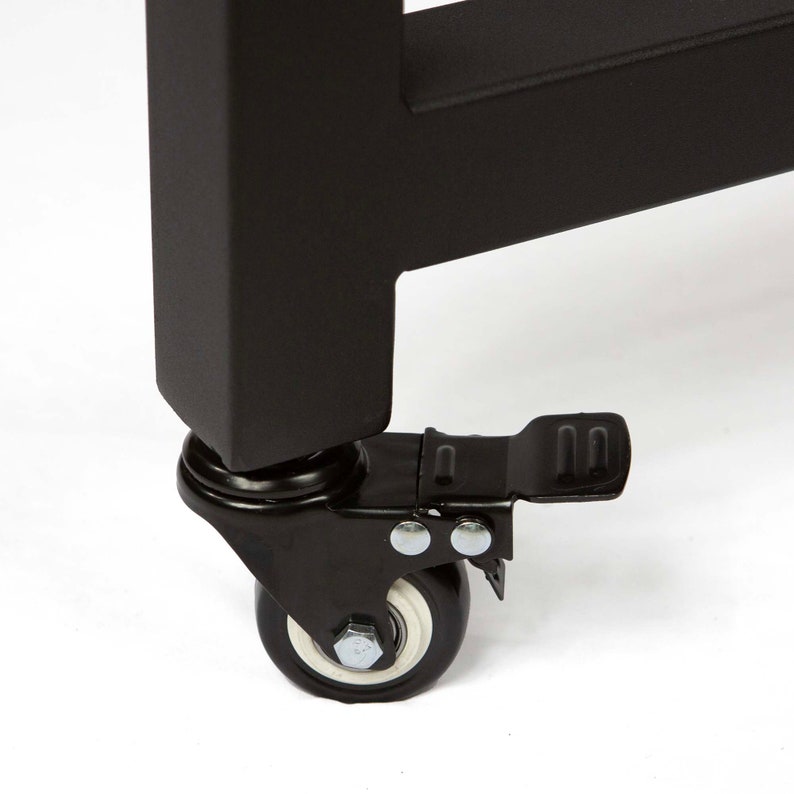 May include: Black metal table leg with a black caster wheel with a white tread and a black foot pedal.