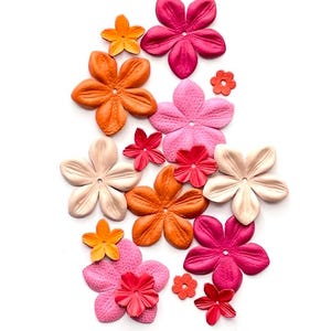 May include: Assortment of colorful paper flowers in shades of orange, pink, and red. The flowers are arranged in a cluster on a white background.