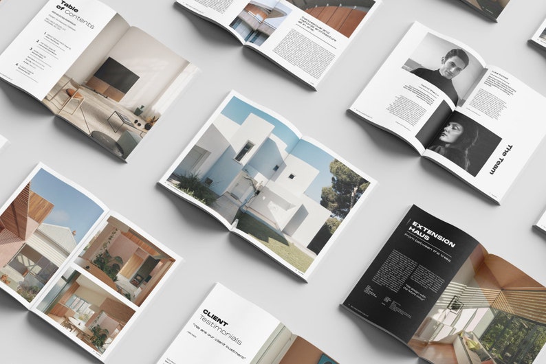 May include: A magazine spread showcasing interior design projects. The pages feature photos of modern homes with clean lines and natural light. The magazine also includes a table of contents, client testimonials, and information about the design team.