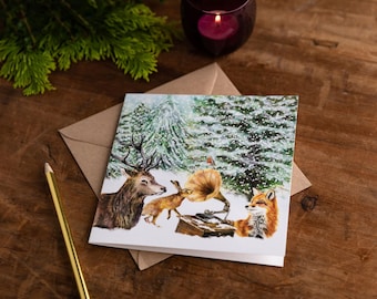 Cartão de Natal quadrado de 15 cm com cena de floresta nevada e envelope kraft.