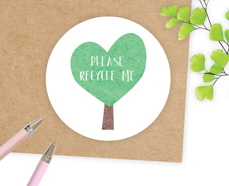 May include: A white sticker with a green heart-shaped tree and the text "PLEASE RECYCLE ME".