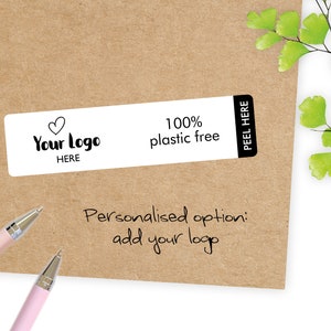 May include: A rectangular white label with the text "Your Logo HERE" and "100% plastic free" on a brown background. The label has a black border with "PEEL HERE" on the right side. The words "Personalised option: add your logo" are written below.