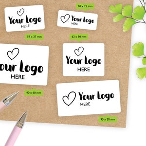 May include: Four white rectangular stickers with black text and a heart symbol. The text on the stickers reads "Your Logo Here". The stickers are different sizes: 6 x 2.5 cm, 6.3 x 5 cm, 9 x 6 cm, and 9.5 x 5 cm.