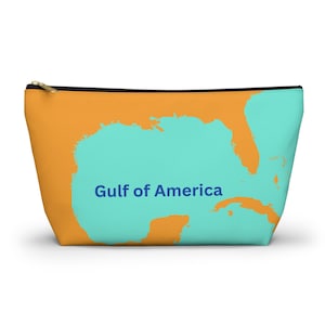 May include: A bright orange zippered pouch with a turquoise blue outline of the Gulf of Mexico. The text "Gulf of America" is printed in blue on the pouch.