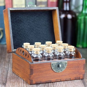 Wooden apothecary chest for potions or essential oil storage box with 12 glass bottles, cork stoppers and labels. Personalisation option.