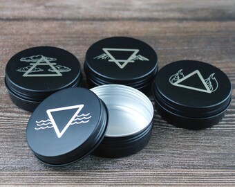 Set of four engraved Wicca elemental storage tins.