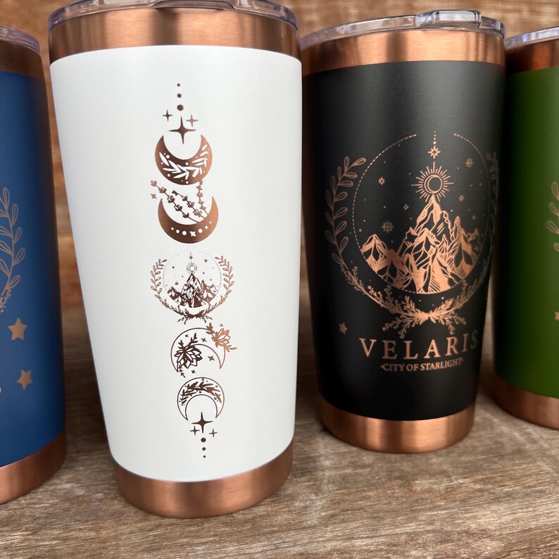 20oz Coffee Tumbler in colors white, black, red, blue and green. Design is engraved through the color to reveal the copper base layer. Design is based on the fictional book A Court of Thorns and Roses.
