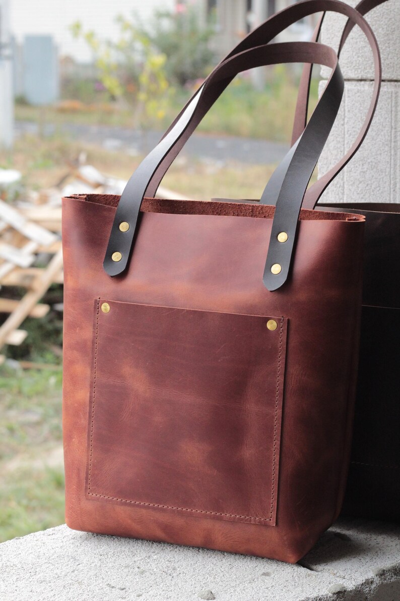 Durable vegetable-tanned leather tote bag that ages beautifully with personal use