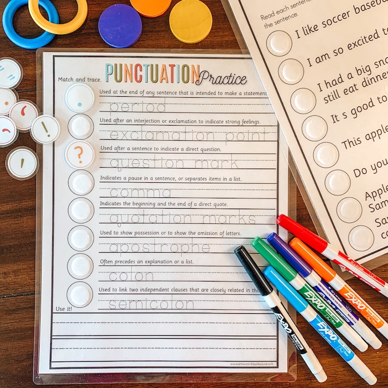 May include: A black and white worksheet with the title "Punctuation Practice". The worksheet has a list of punctuation marks with their definitions and examples. There are also circles with punctuation marks on them that can be matched to the definitions.