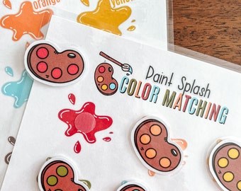 May include: Paint Splash Color Matching game with colorful paint splatters and paint palettes. The game includes instructions to match the colors.