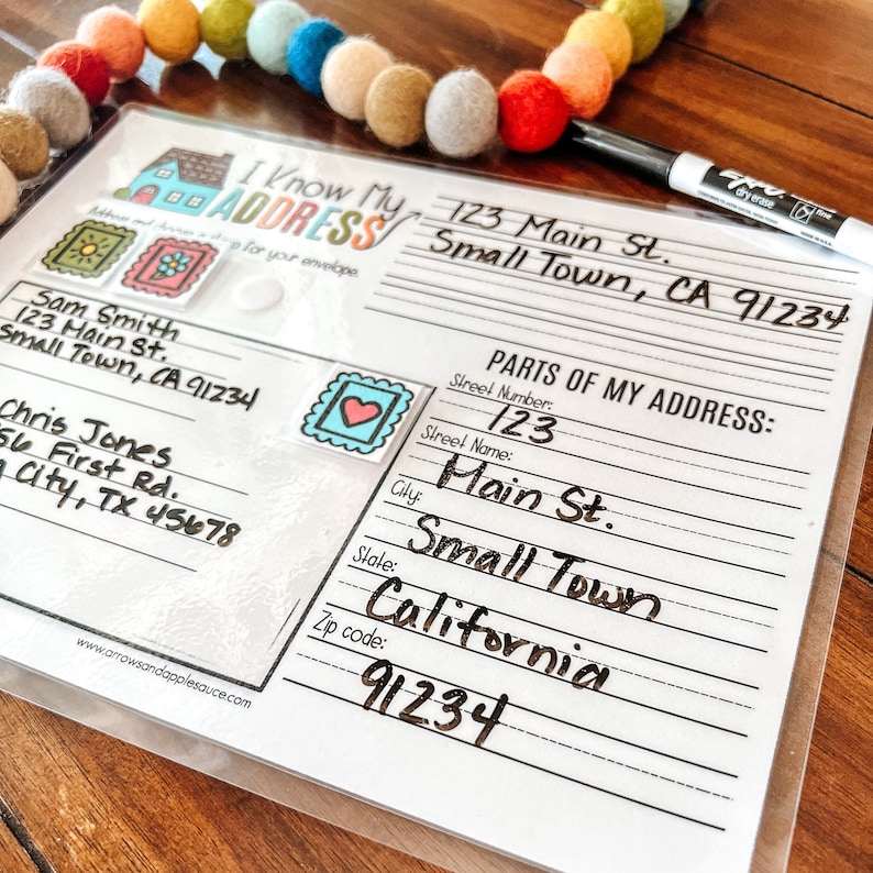 May include: A printable worksheet for learning about addresses. The worksheet features a house illustration, a sample address, and a section for breaking down the address into its parts, including street number, street name, city, state, and zip code.
