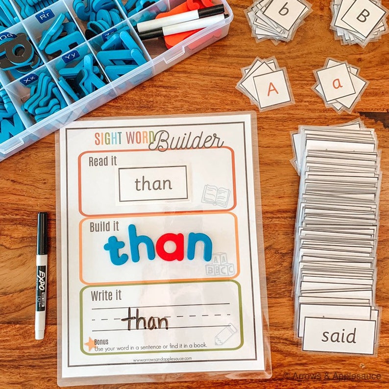 May include: A sight word builder activity with the word "than" written in a box. The word is spelled out with magnetic letters and there is a line for writing the word. The activity also includes a bonus section to use the word in a sentence or find it in a book.