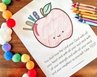 May include: A printable coloring page featuring a red apple with a smiling face and the word "Love" written above it. The page also includes a Bible verse: "You shall love the Lord your God with all your heart and with all your soul and with all your strength and with all your mind, and your neighbor as yourself. Luke 10:27"
