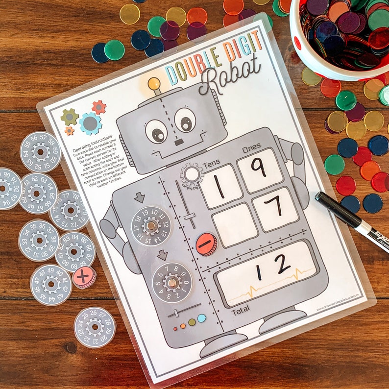 May include: A printable double-digit robot game for kids. The robot has a screen that displays the number 12. The robot has dials for tens and ones, and a plus and minus sign. The game includes instructions for operating the robot.
